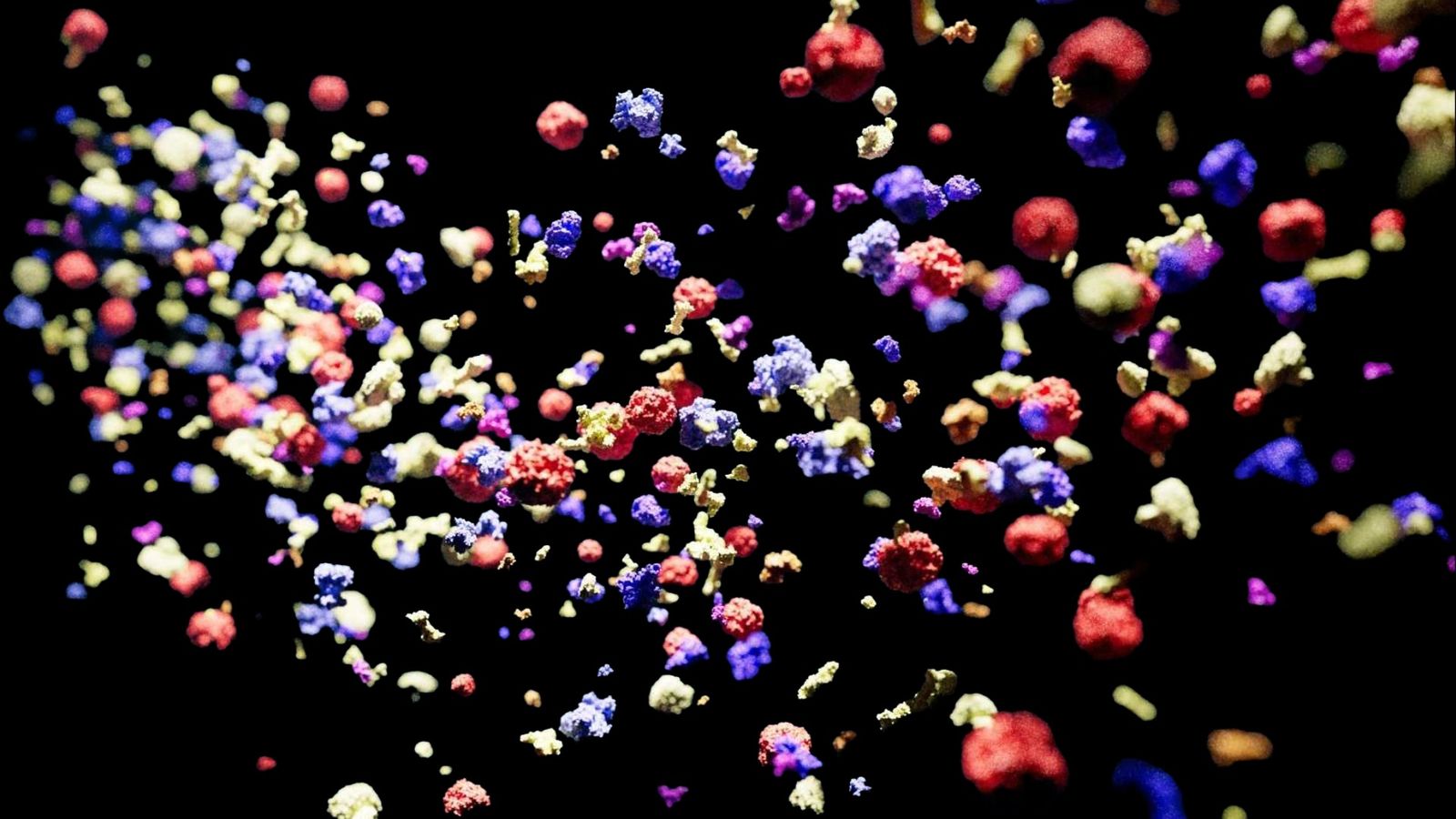 Digital illustration of building block molecules colored in yellow red and purple