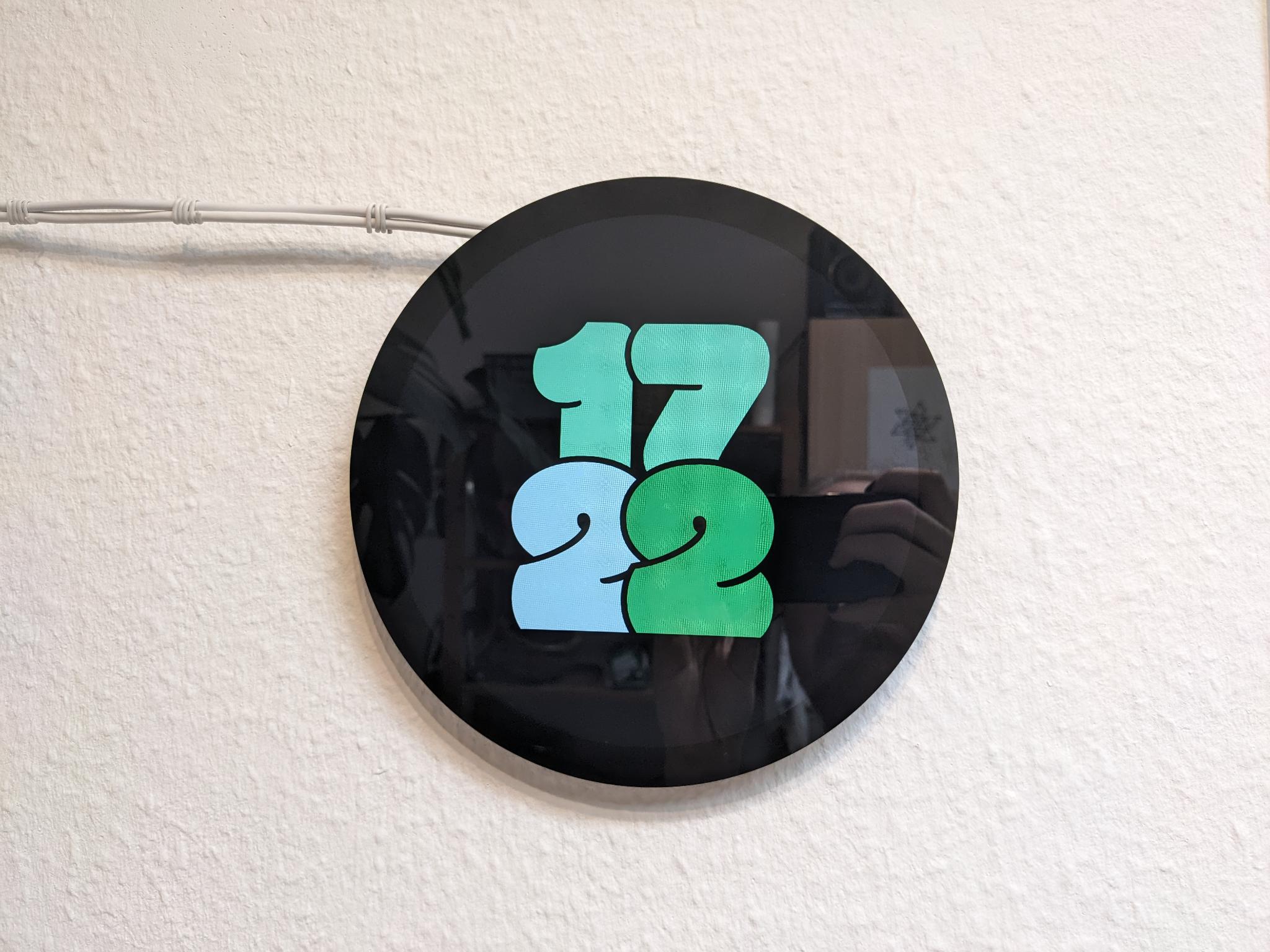 A clock face that has four bubbly digits